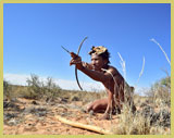 . A ǂKhomani-San man poised with his bow and arrow, exemplifies the traditional life-styles which persist in South Africa’s ǂKhomani-San Cultural Landscape UNESCO world heritage site