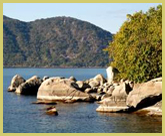 The rocky shores of Lake Malawi povide habitat for more than 500 species of endemic cichlid fishes, many of which are protected in Lake Malawi National Park world heritage site