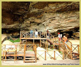 Viewing platform for visitors to see the rock art at the Main Cave, Giants Castle Game Reserve within the uKhahlamba Drakensberg Mountains Park, a UNESCO world heritage site (South Africa)
