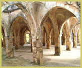 The arches and vaulted roof of the Great Mosque is one of the most impressive buildings at the Ruins of Kilwa Kisiwani and Ruins of Songo Mnara UNESCO world heritage site on the Swahili coast of Tanzania (East Africa)