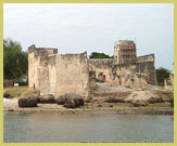 The Omani-Arab Fortress (Gereza) at the point of arrival by boat at the Ruins of Kilwa Kisiwani UNESCO world heritage site on the Swahili coast of Tanzania (East Africa)