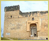 The imposing walls and fortifications of the Omani-Arab Fortress (Gereza) at the Ruins of Kilwa Kisiwani UNESCO world heritage site on the Swahili coast of Tanzania (East Africa)