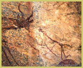 Detail of an ochre-based hunting scene in the Kondoa rock art world heritage site, Tanzania (Africa)