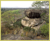 A typical rock art shelter in the deciduous woodlands of the Maasai Steppe, part of the Kondoa rock art world heritage site, Tanzania (Africa)