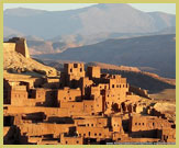 View of the Ksar of Ait-Ben-Haddou UNESCO world heritage site (near Ouarzazate, Morocco) with the Atlas Mountains behind