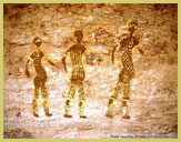 Three figures as depicted in one of the rock-art galleries at Tassili N'Ajjer National Park & UNESCO world heritage site in Algeria (north Africa)